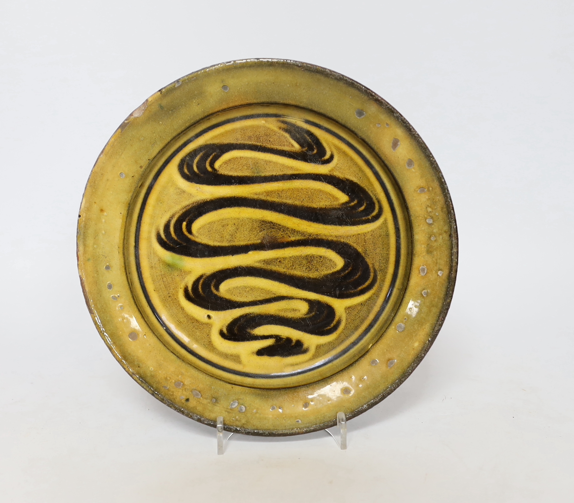 Michael Cardew for Winchcombe pottery, a slip decorated plate, c.1936-45
